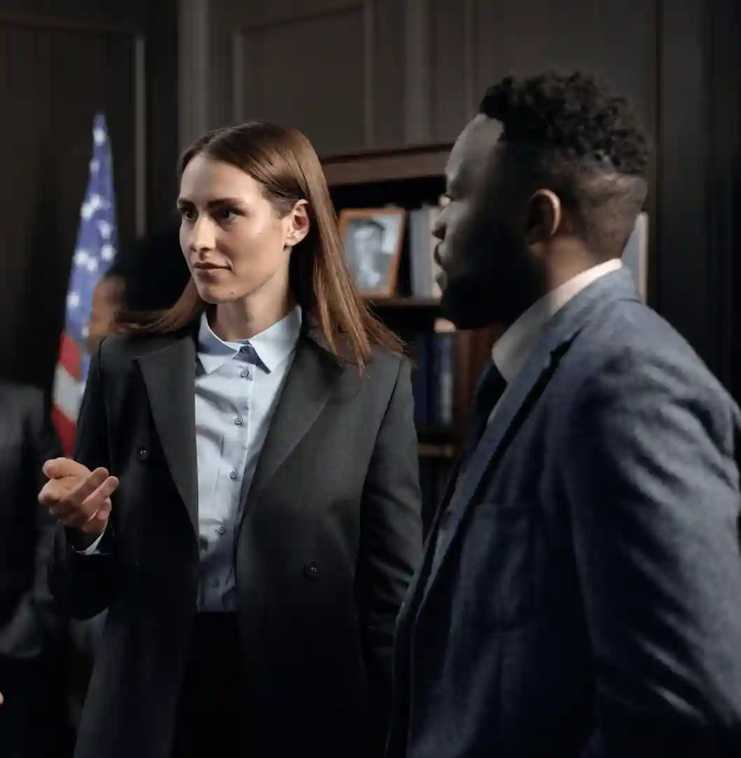 Professional woman and man in conversation.