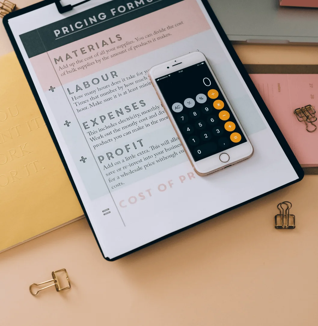 Smartphone showing calculator over pricing form.
