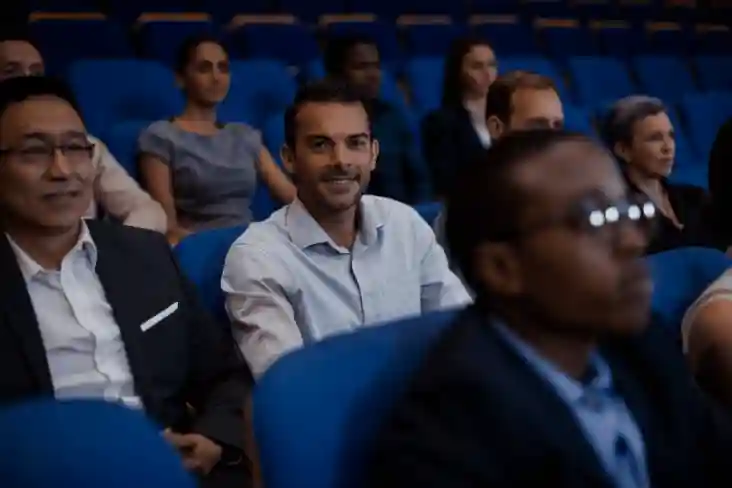 Audience members seated in Charisma university auditorium in event.